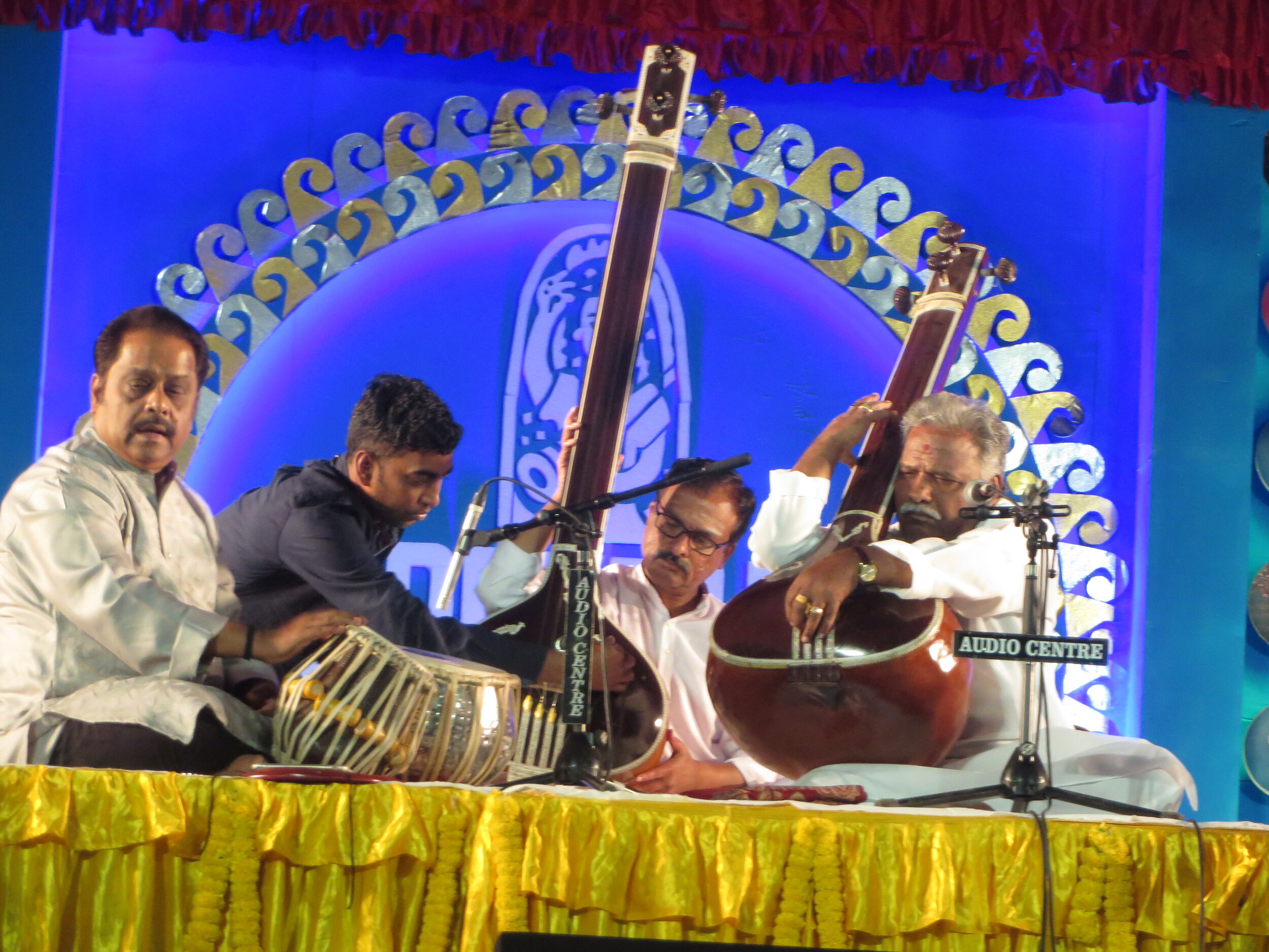 Pandit Venkatesh Kumar tuning the taanpura with tabla maestro Pandit Samar Saha at Dover Lane Music Conference 2020.